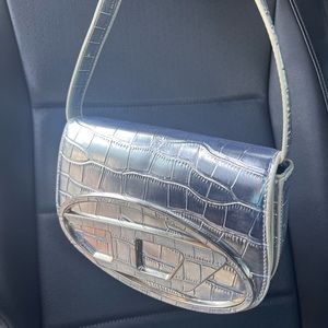 - Iconic bag in mirrored leather